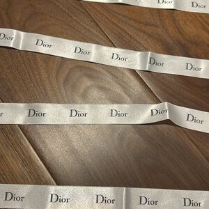 4 various sizes authentic Dior ribbons.
